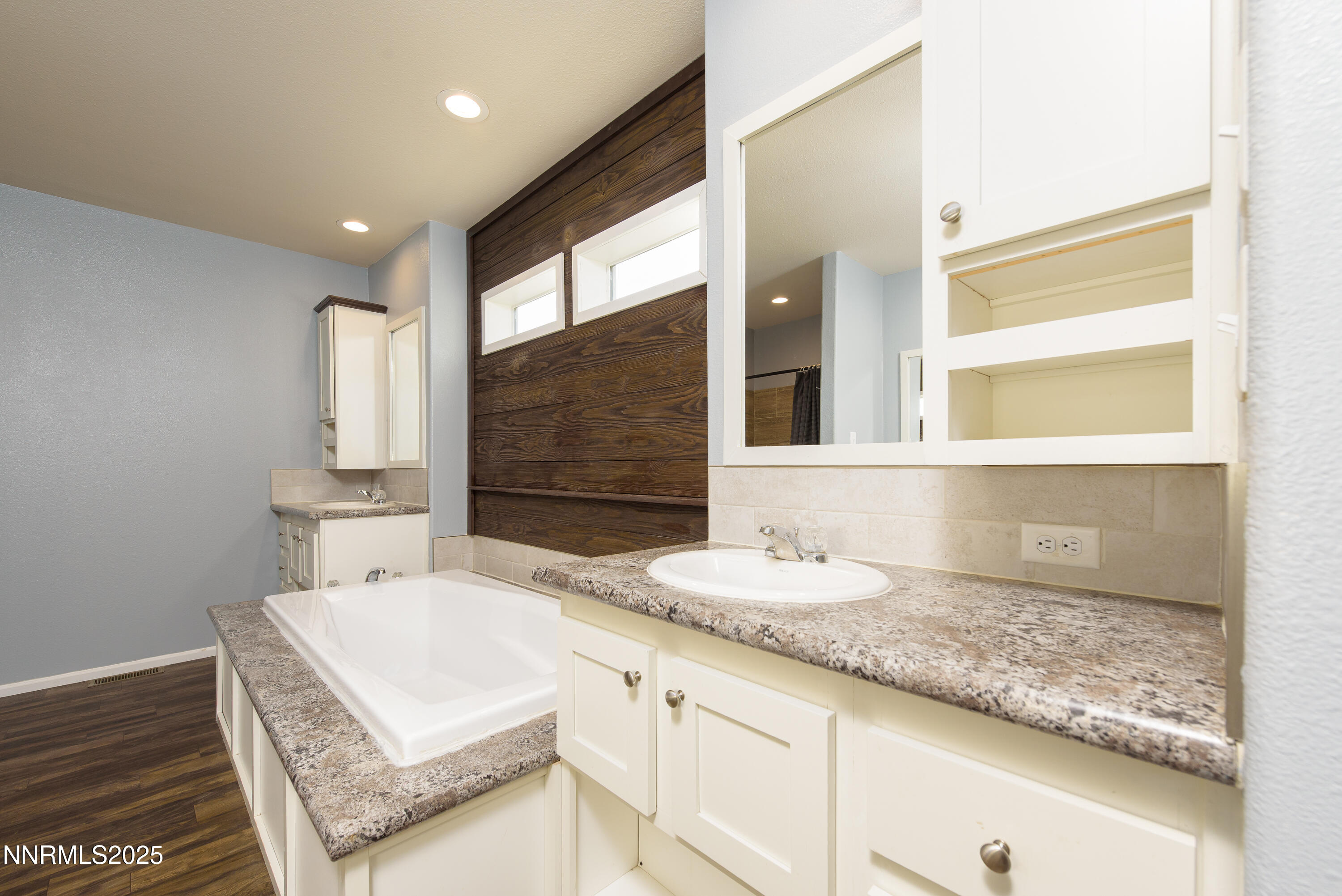 2595 4th Street Silver Springs, NV 89429 - Photo 25 of 54 a bathroom with a granite countertop sink and a mirror