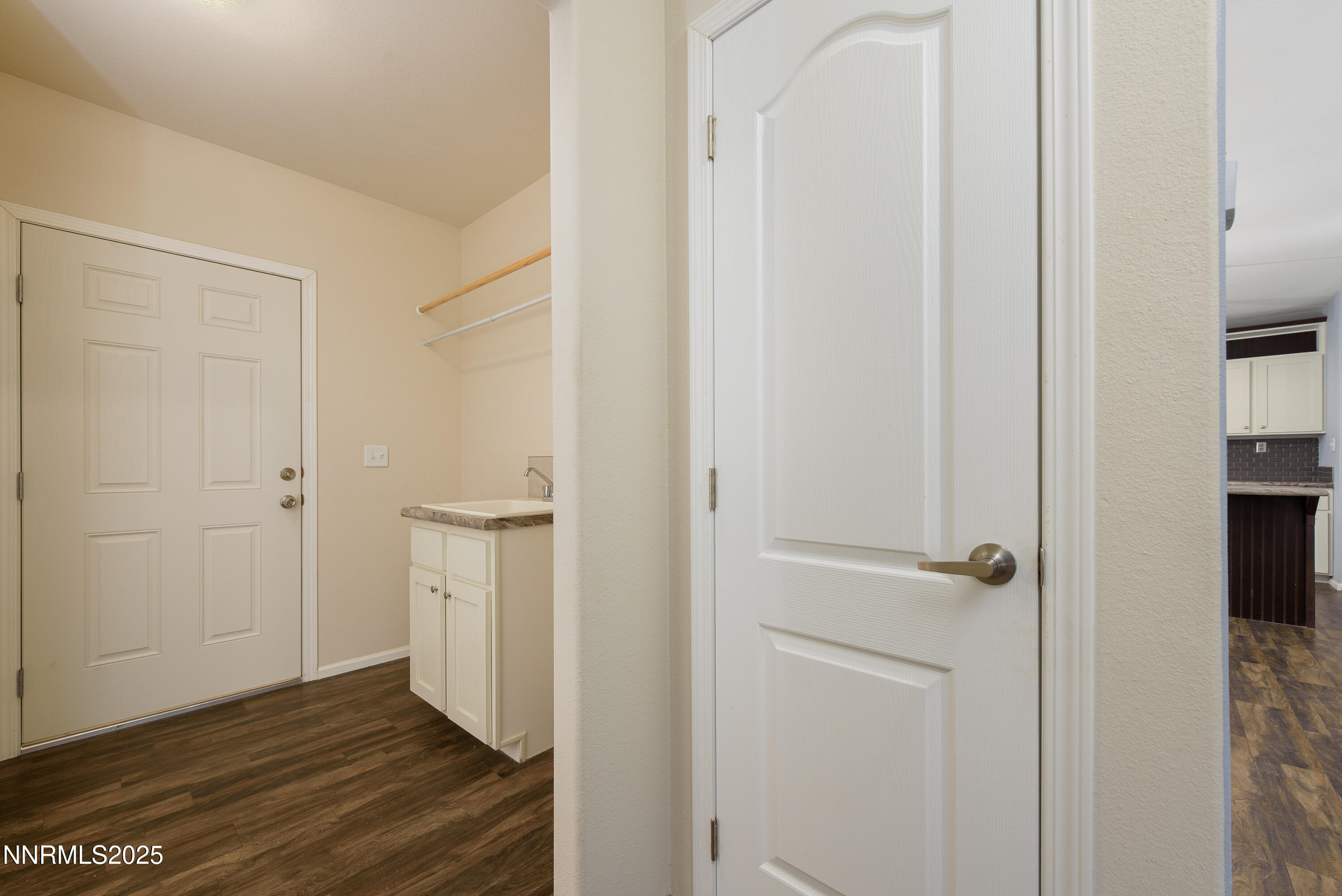 2595 4th Street Silver Springs, NV 89429 - Photo 31 of 54 a view of a hallway with wooden floor and closet