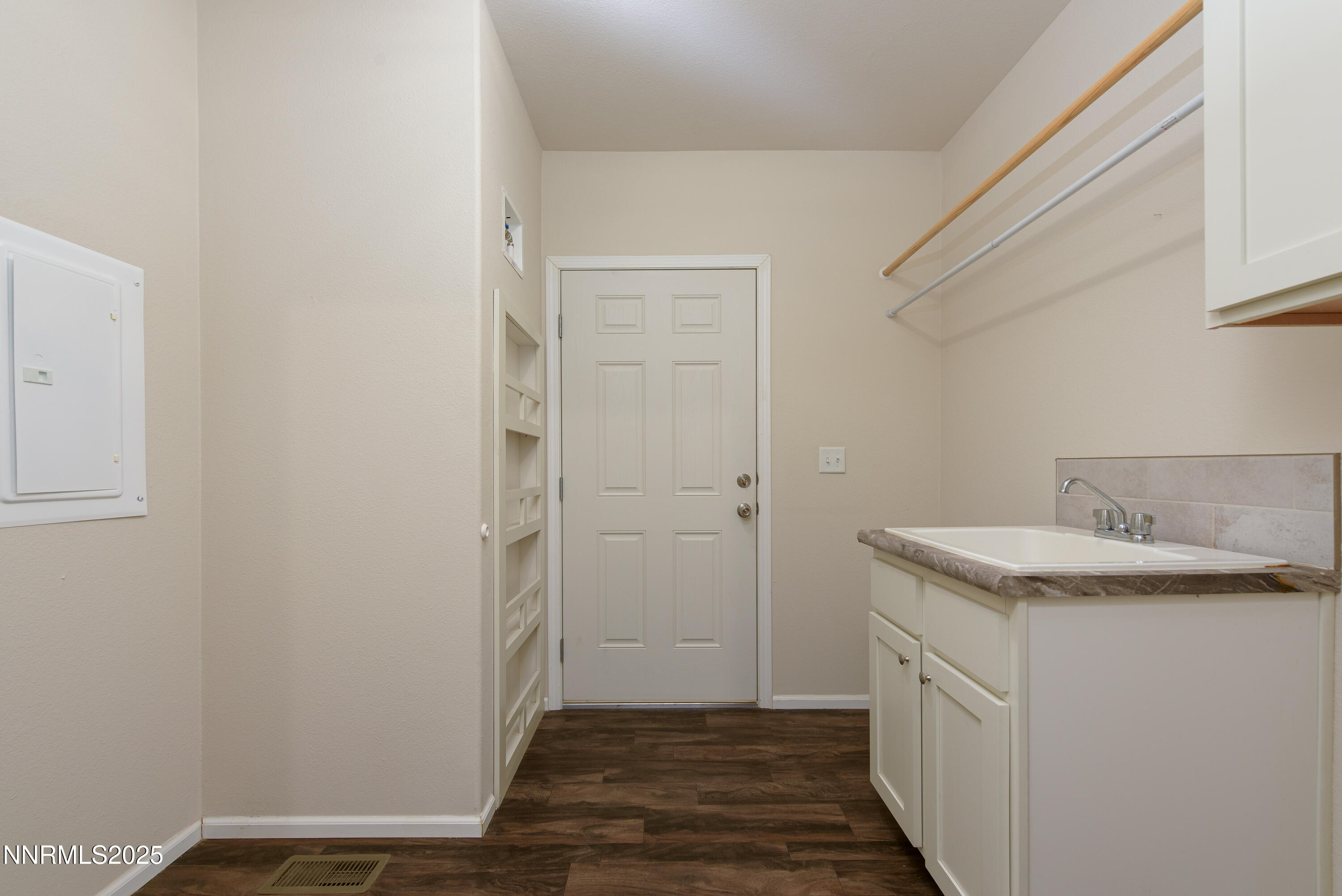 2595 4th Street Silver Springs, NV 89429 - Photo 32 of 54 a bathroom with a sink and a mirror