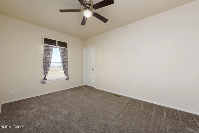 a view of a big room with carpet