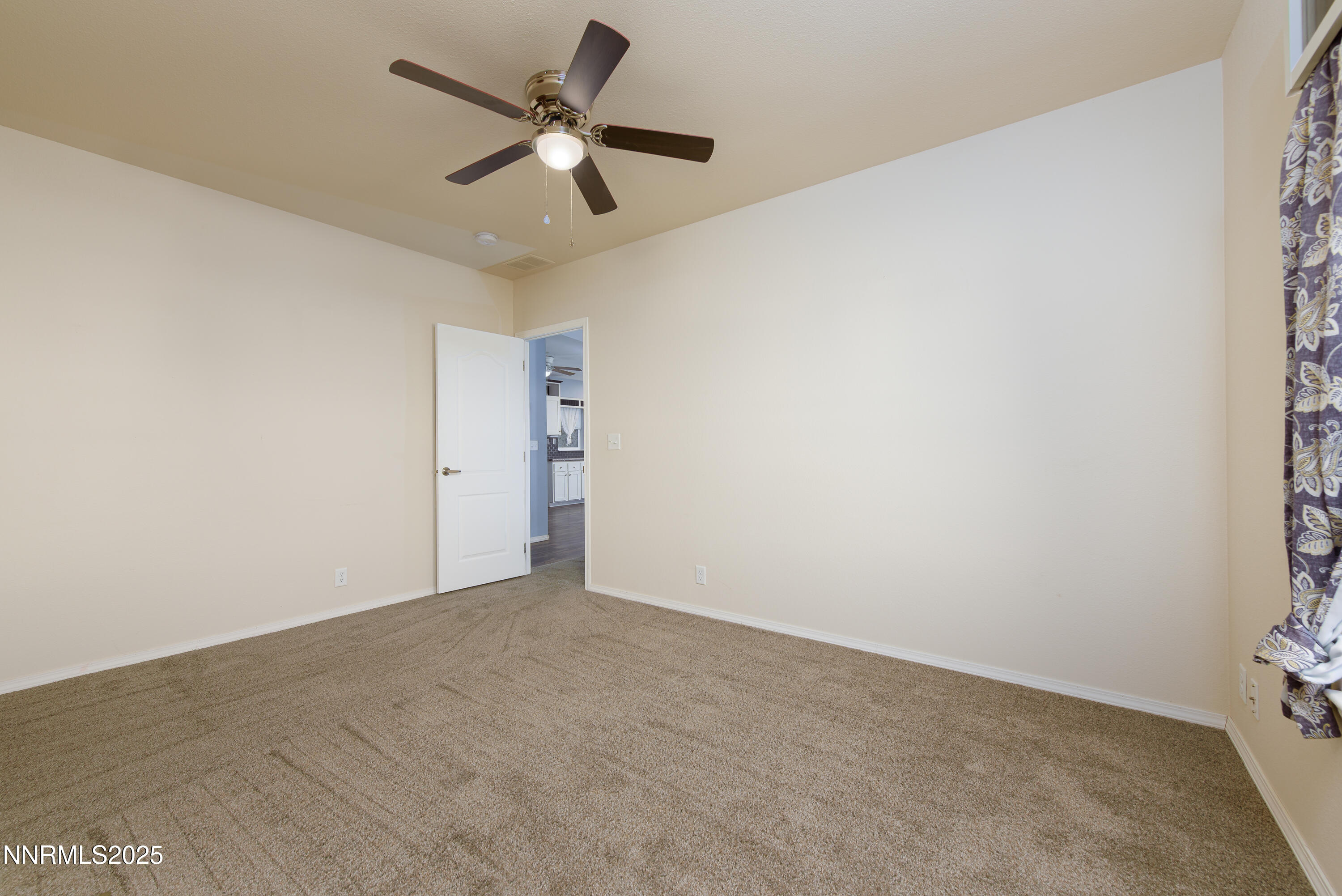 2595 4th Street Silver Springs, NV 89429 - Photo 37 of 54 a view of a big room with carpet