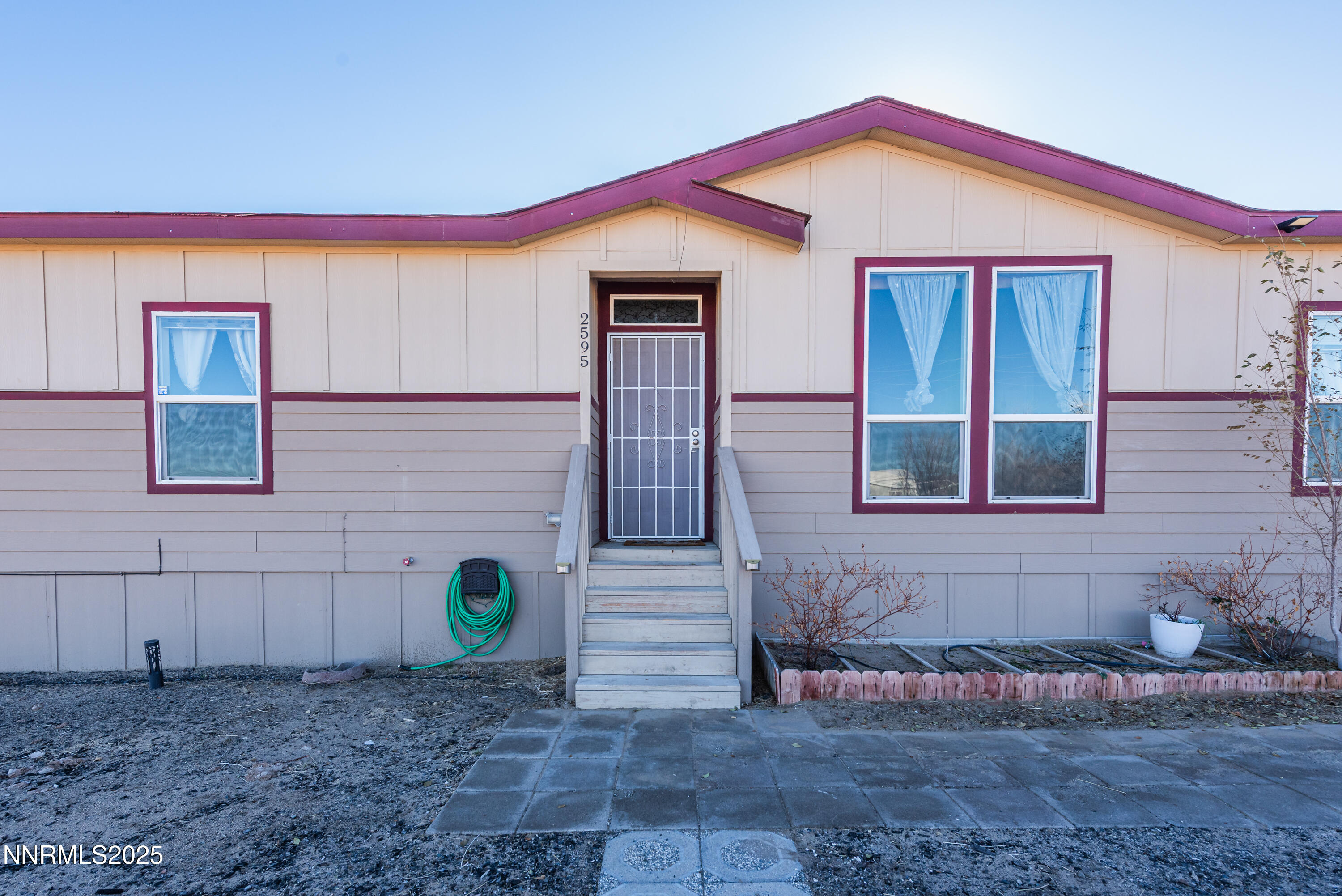 2595 4th Street Silver Springs, NV 89429 - Photo 4 of 54 a front view of a house with entryway