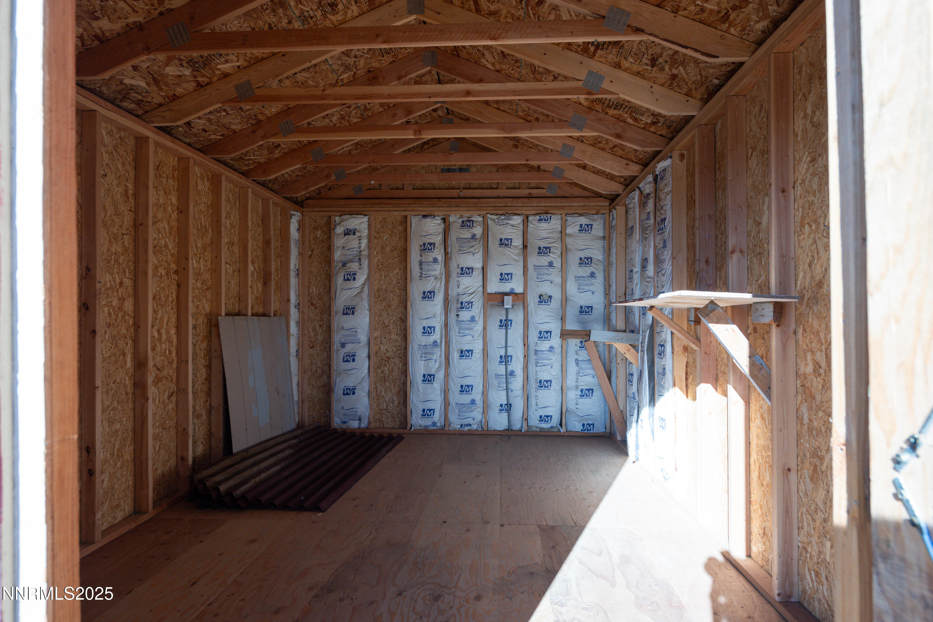 2595 4th Street Silver Springs, NV 89429 - Photo 45 of 54 a view of a hallway with wooden walls and stairs