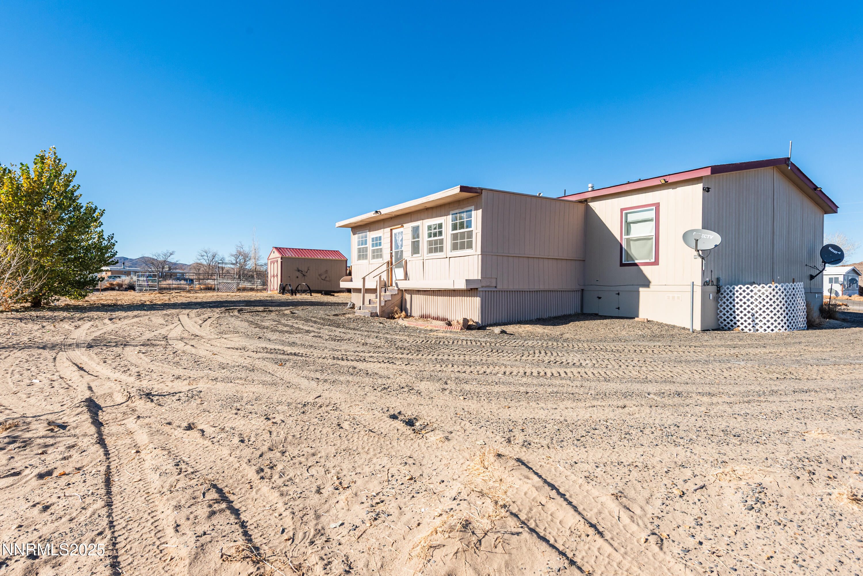 2595 4th Street Silver Springs, NV 89429 - Photo 49 of 54 a view of a house with a yard