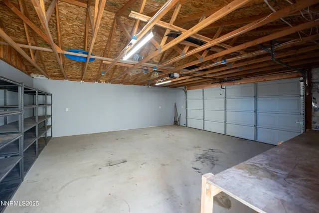 a view of a kitchen with a sink cabinets and a ceiling fan