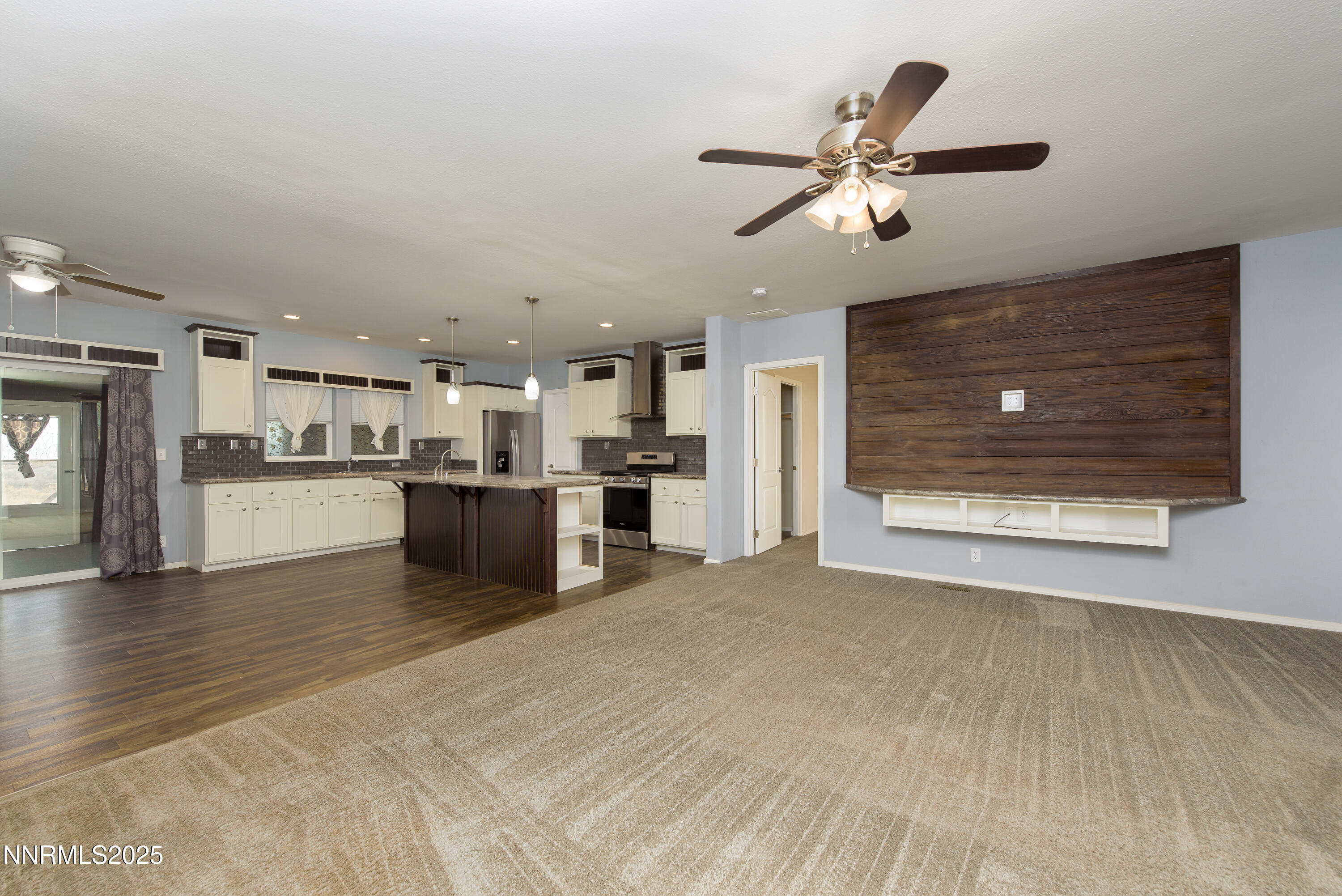 2595 4th Street Silver Springs, NV 89429 - Photo 10 of 54 a view of a kitchen with a sink cabinets and a ceiling fan