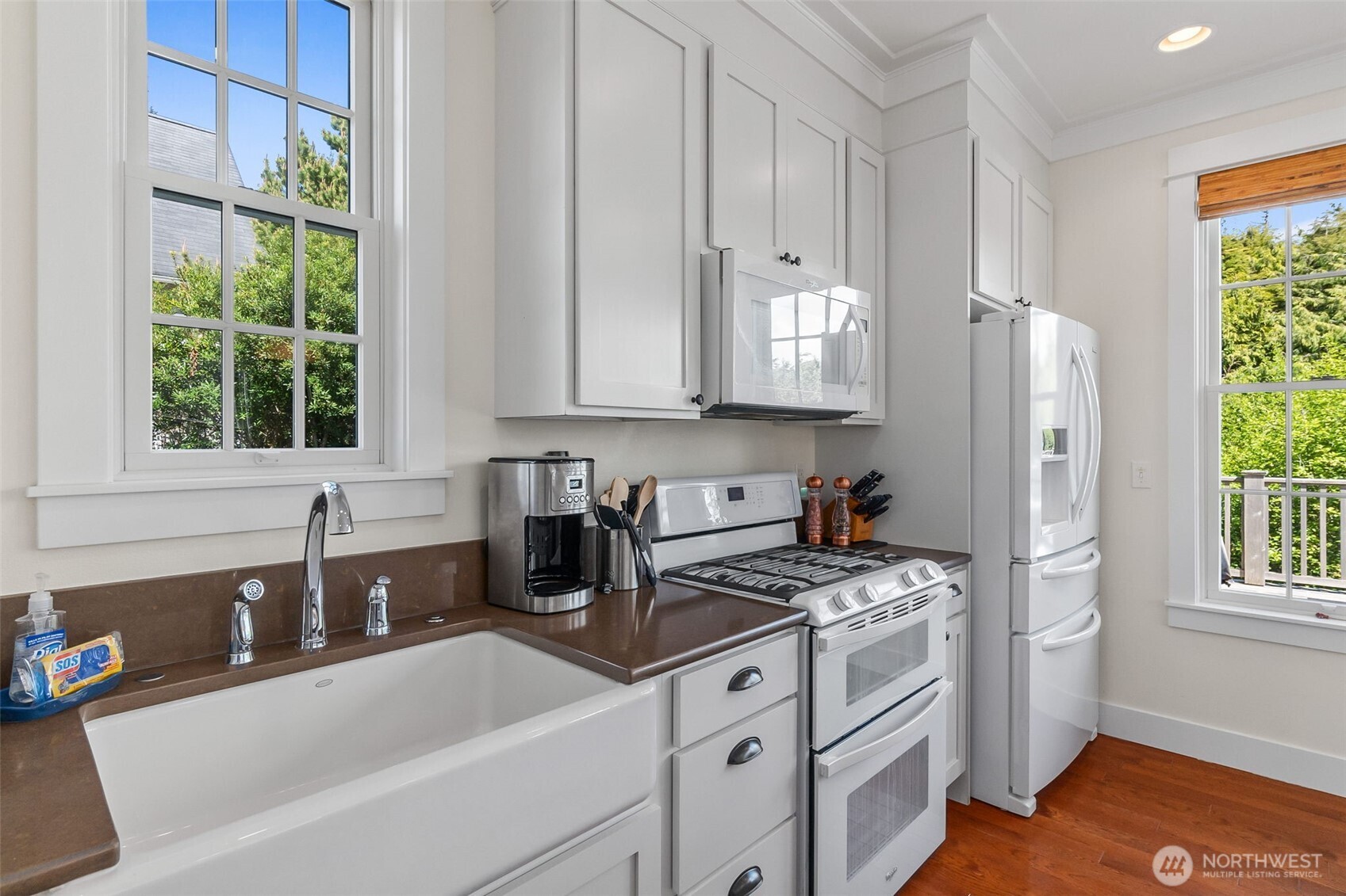 81 Compass Street Pacific Beach, WA 98571 - Photo 11 of 40 a kitchen with stainless steel appliances a sink a stove and a refrigerator