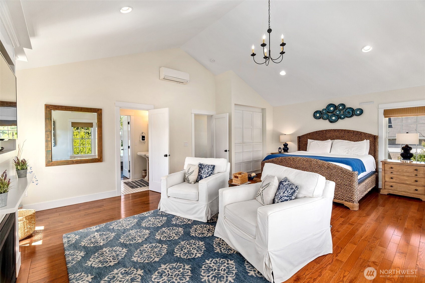 81 Compass Street Pacific Beach, WA 98571 - Photo 15 of 40 a bedroom with a bed and wooden floor