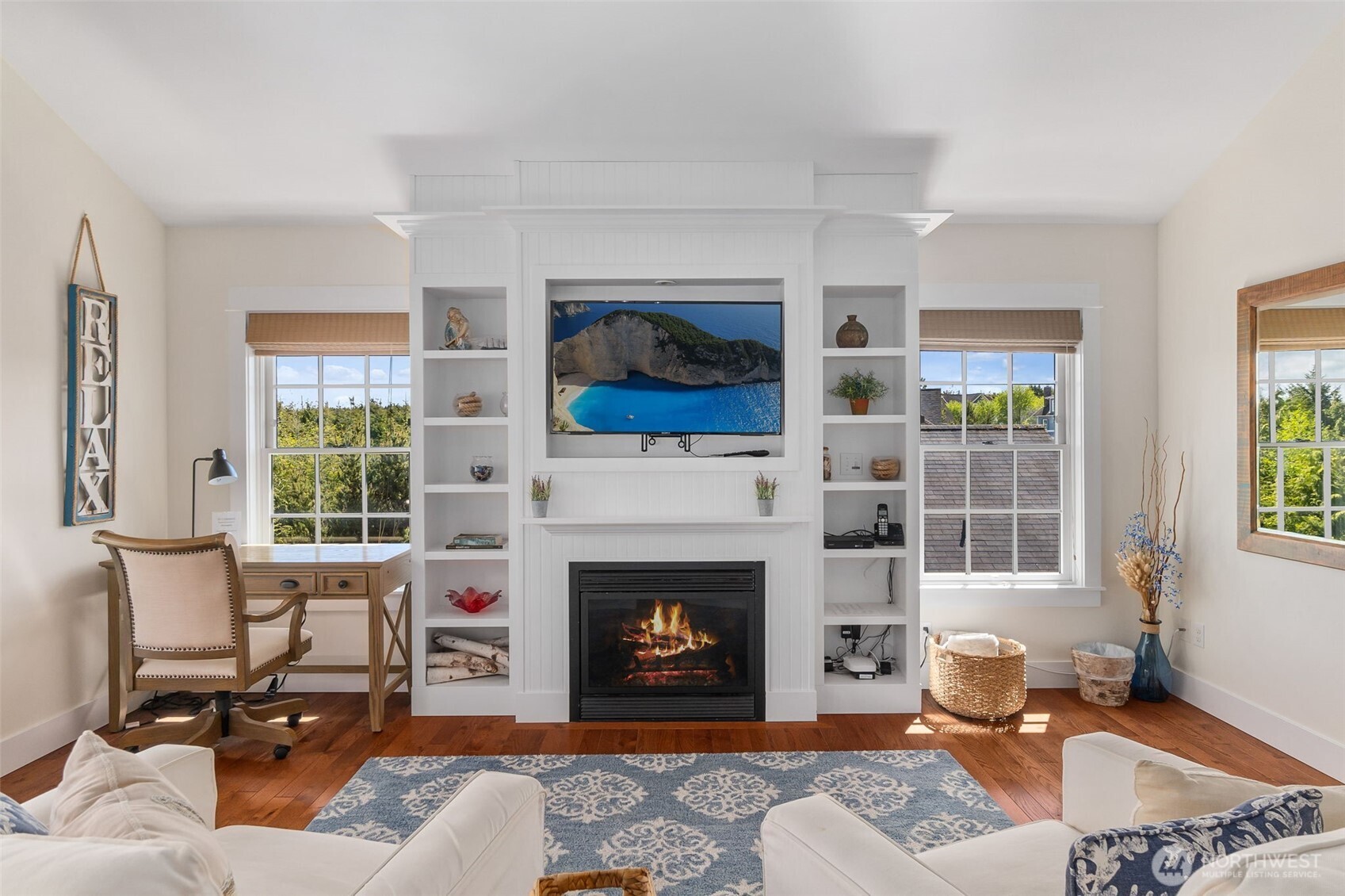 81 Compass Street Pacific Beach, WA 98571 - Photo 19 of 40 a living room with furniture a fireplace and window