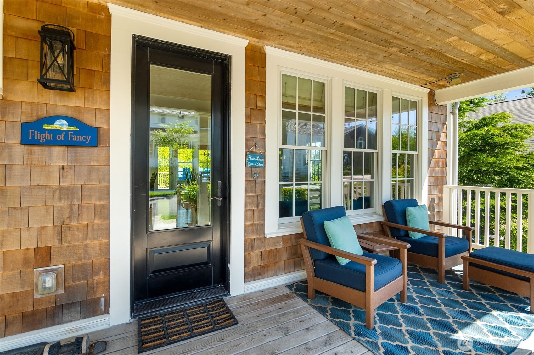 81 Compass Street Pacific Beach, WA 98571 - Photo 2 of 40 a building outdoor space with patio furniture and wooden floor