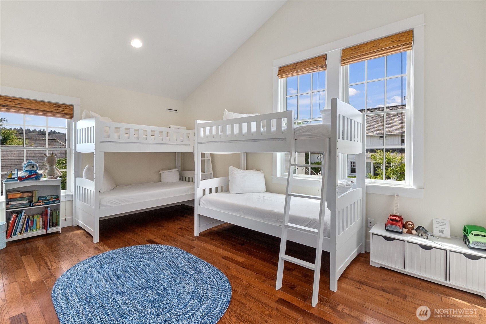81 Compass Street Pacific Beach, WA 98571 - Photo 22 of 40 a bedroom with furniture and a wooden floor