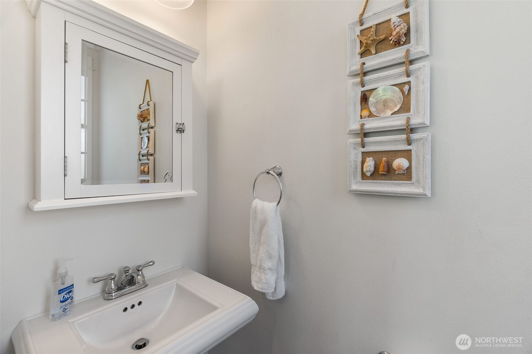 81 Compass Street Pacific Beach, WA 98571 - Photo 24 of 40 a bathroom with a sink and a mirror