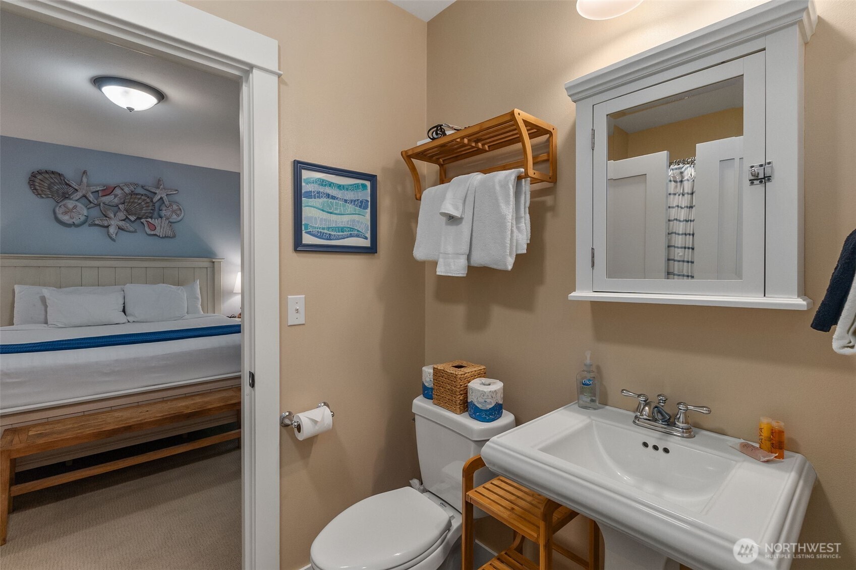 81 Compass Street Pacific Beach, WA 98571 - Photo 25 of 40 a bathroom with a sink mirror and toilet