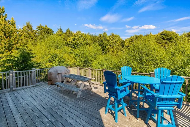 a view of a deck with furniture and outside space