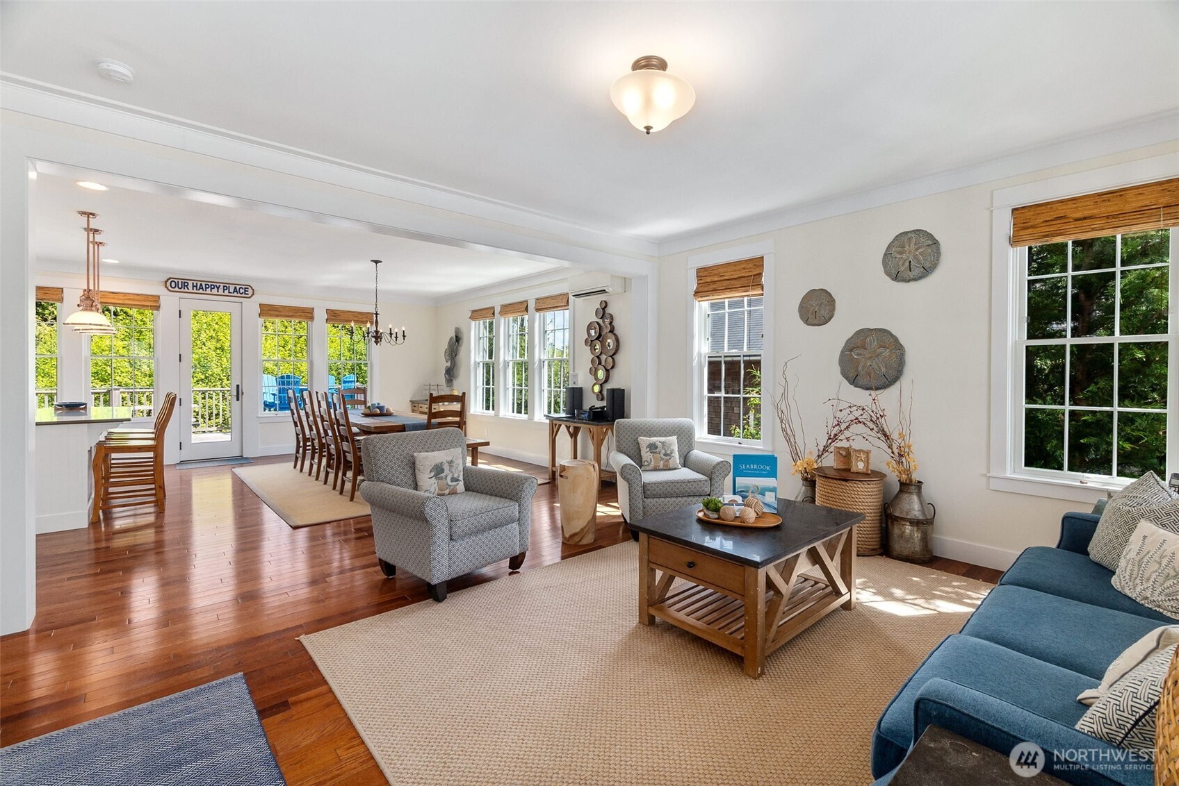 81 Compass Street Pacific Beach, WA 98571 - Photo 5 of 40 a living room with fireplace furniture and a large window