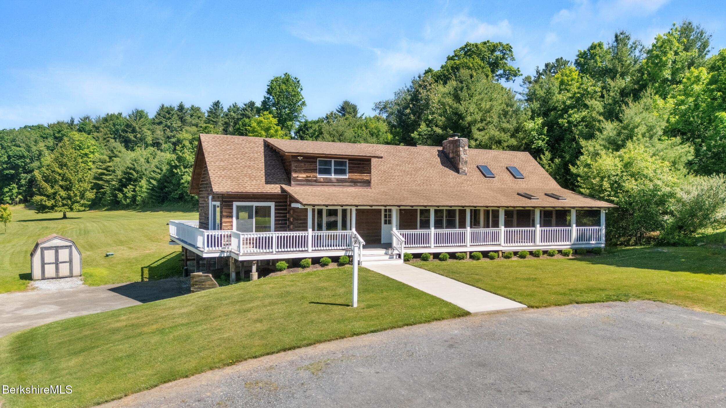 134 Hurlburt Road Great Barrington, MA 01230 - Photo 4 of 50 a view of a house with pool and a yard