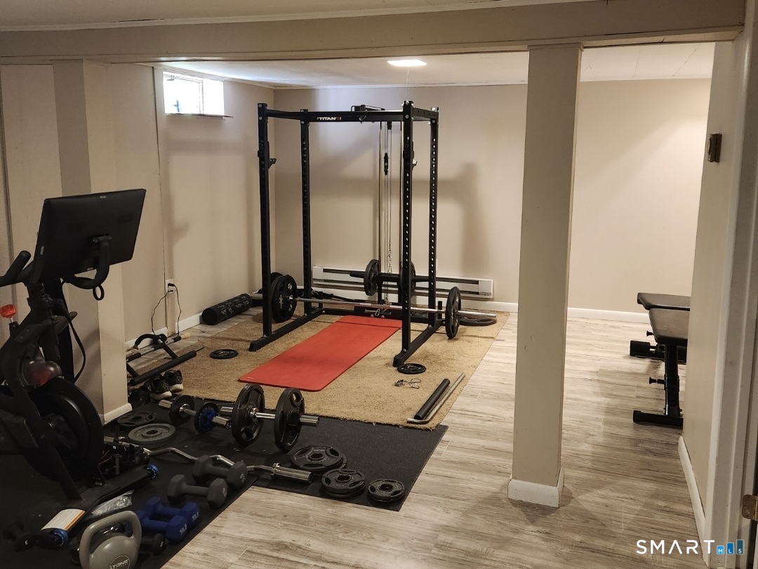 45 Fieldstream Drive Waterbury, CT 06704 - Photo 13 of 16 a room with gym equipment and a mirror
