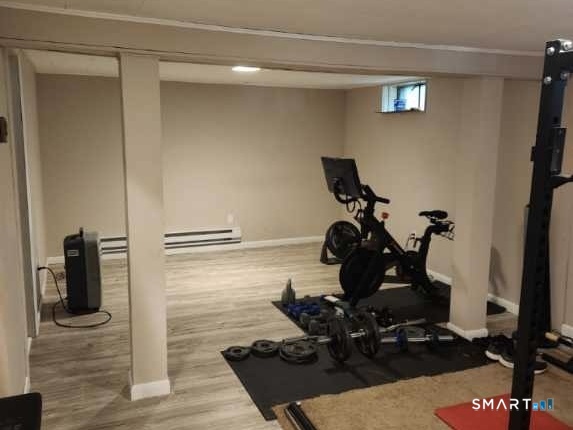 45 Fieldstream Drive Waterbury, CT 06704 - Photo 14 of 16 a room with wooden floor and gym equipment