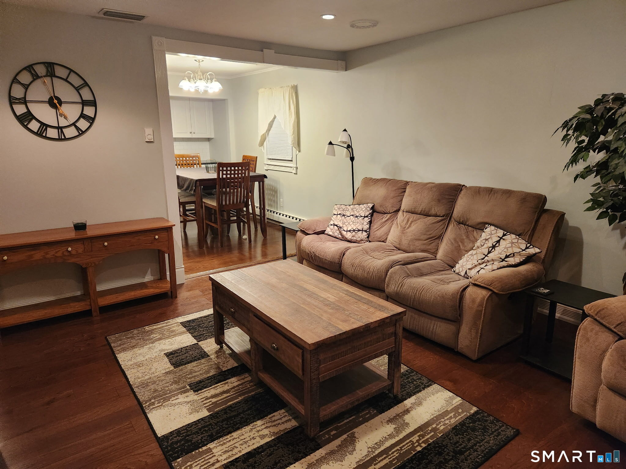 45 Fieldstream Drive Waterbury, CT 06704 - Photo 3 of 16 a living room with furniture a table and wooden floor