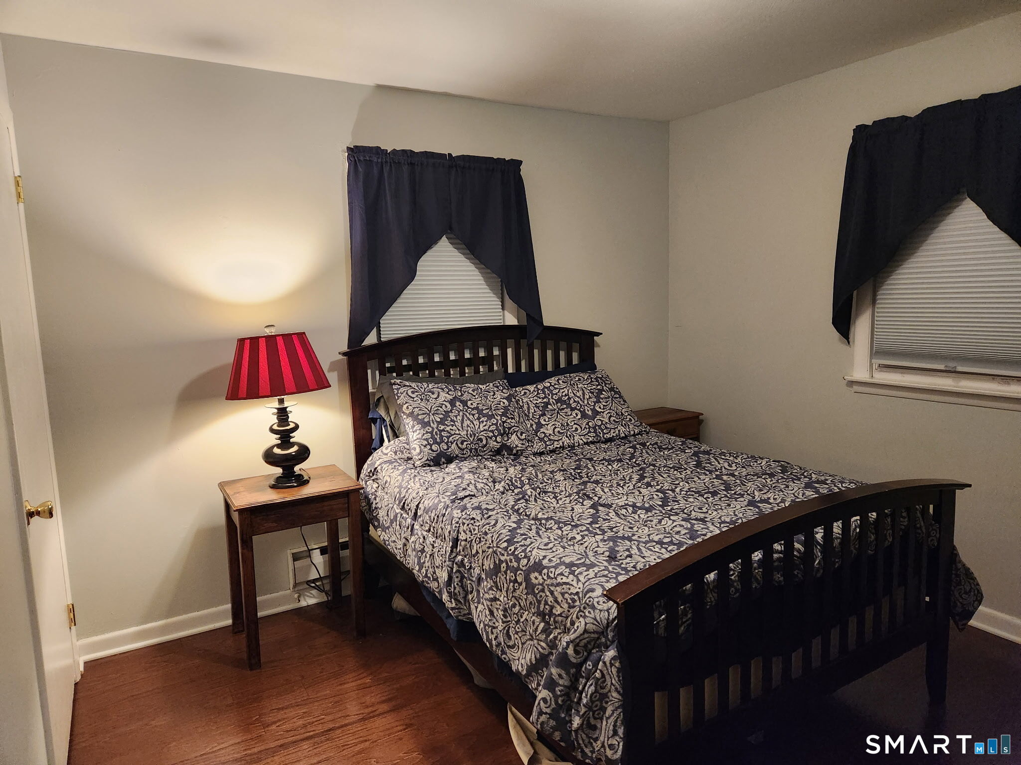 45 Fieldstream Drive Waterbury, CT 06704 - Photo 10 of 16 a bedroom with a bed and a lamp on table