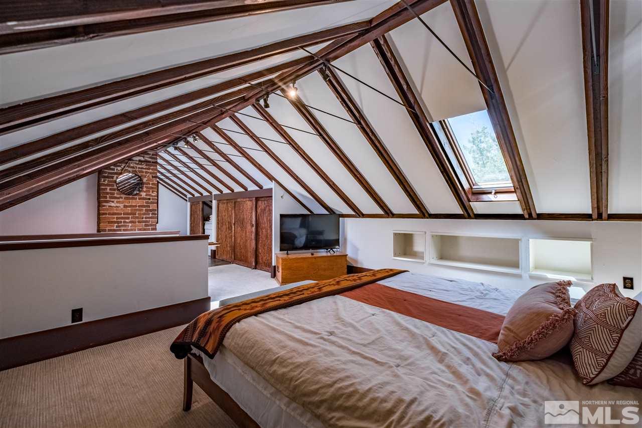 588 Marsh Avenue Reno, NV 89509 - Photo 20 of 28 a bedroom with a bed and a large window