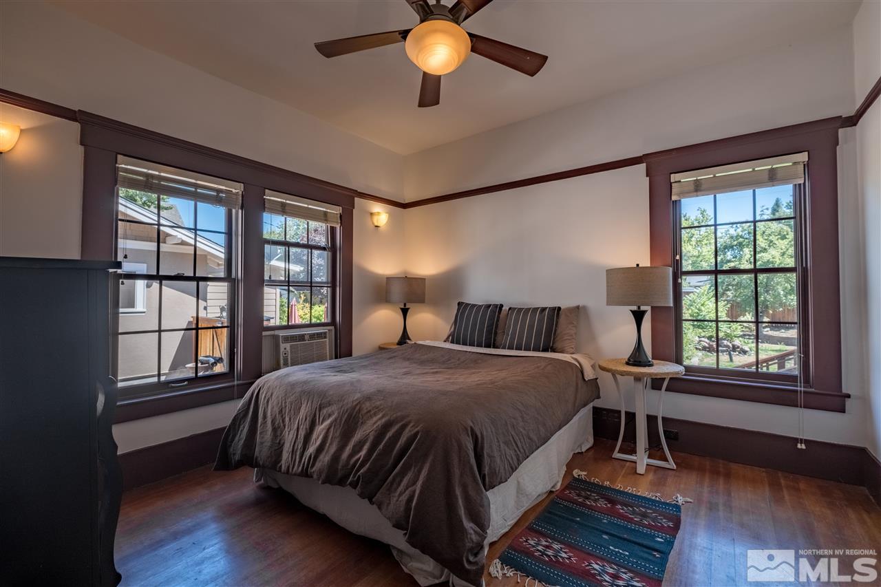 588 Marsh Avenue Reno, NV 89509 - Photo 8 of 28 a bed sitting in a bedroom next to a window