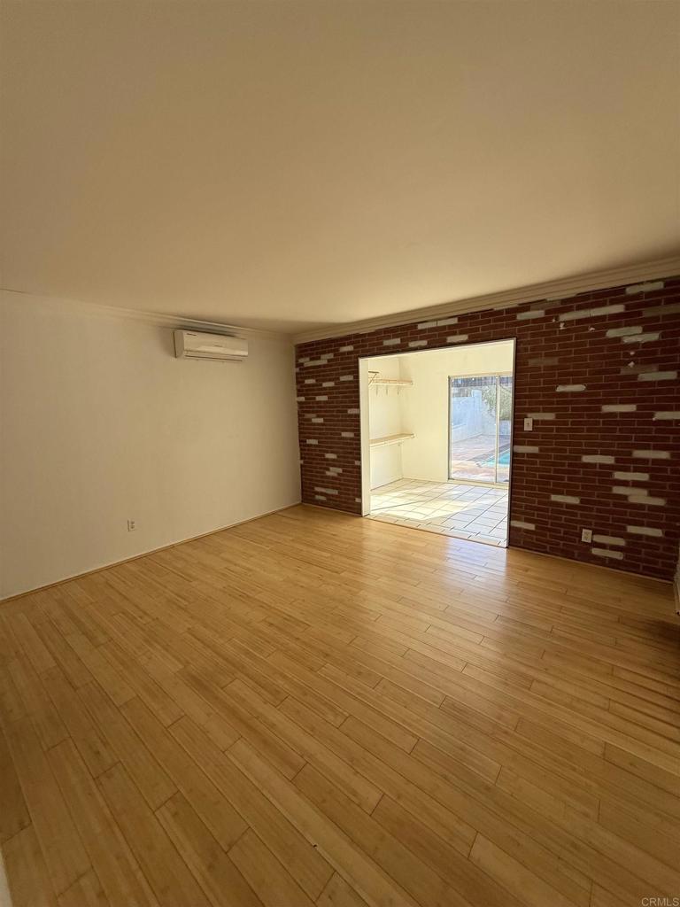 8859 Kelburn Avenue Spring Valley, CA 91977 - Photo 11 of 15 wooden floor in an empty room with a window
