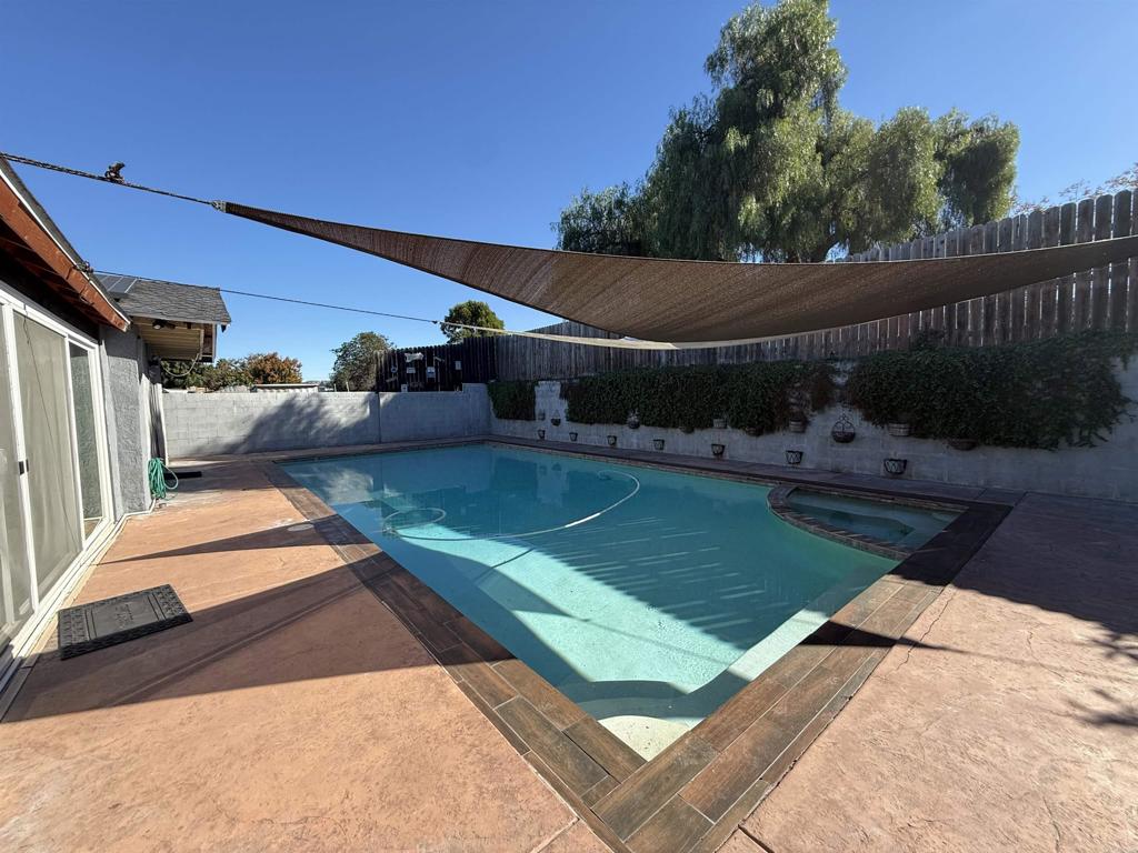 8859 Kelburn Avenue Spring Valley, CA 91977 - Photo 14 of 15 a view of a backyard with plants and a patio