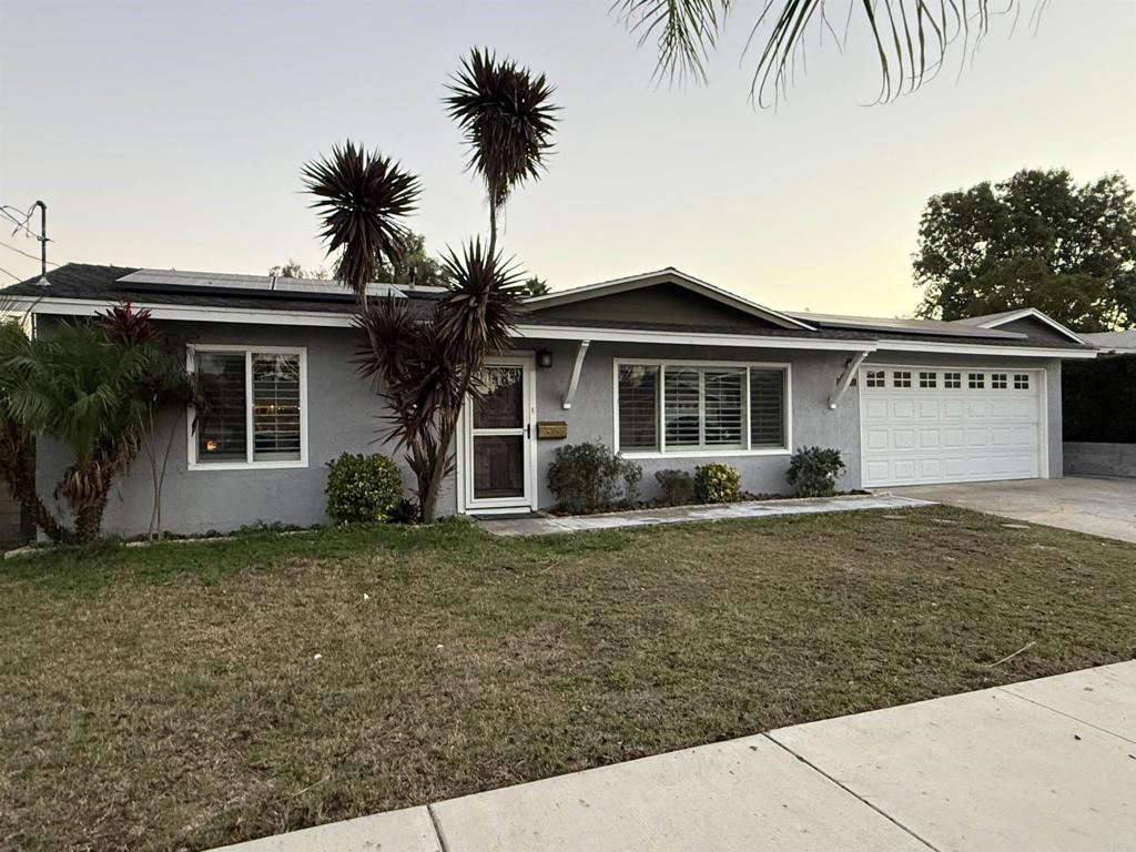 8859 Kelburn Avenue Spring Valley, CA 91977 - Photo 2 of 15 a front view of a house with a garden