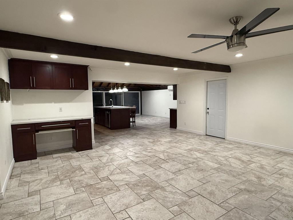 8859 Kelburn Avenue Spring Valley, CA 91977 - Photo 8 of 15 a view of a livingroom with furniture and a ceiling fan