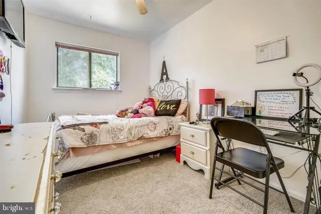 a bedroom with a bed and a chair