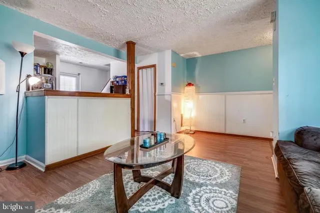 a view of a livingroom with furniture and wooden floor