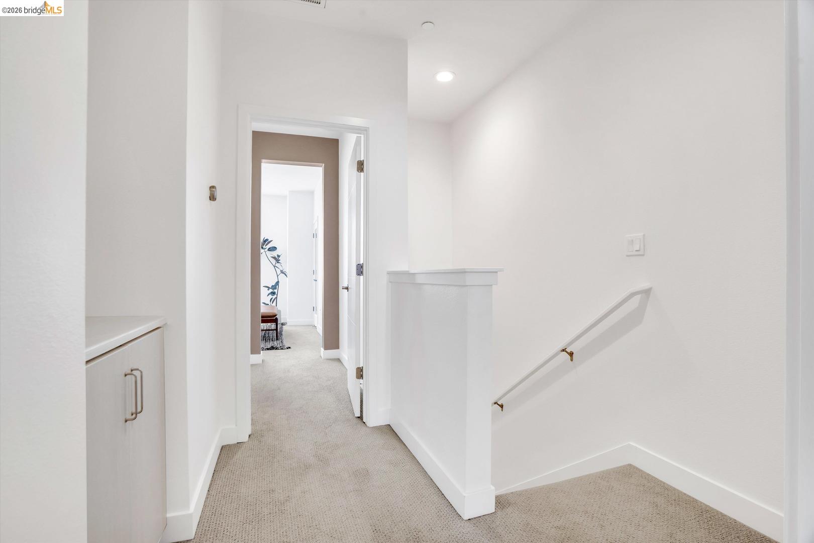 2229 Myrtle Street Oakland, CA 94607 - Photo 14 of 37 hallway with an upstairs landing, light carpet, and recessed lighting