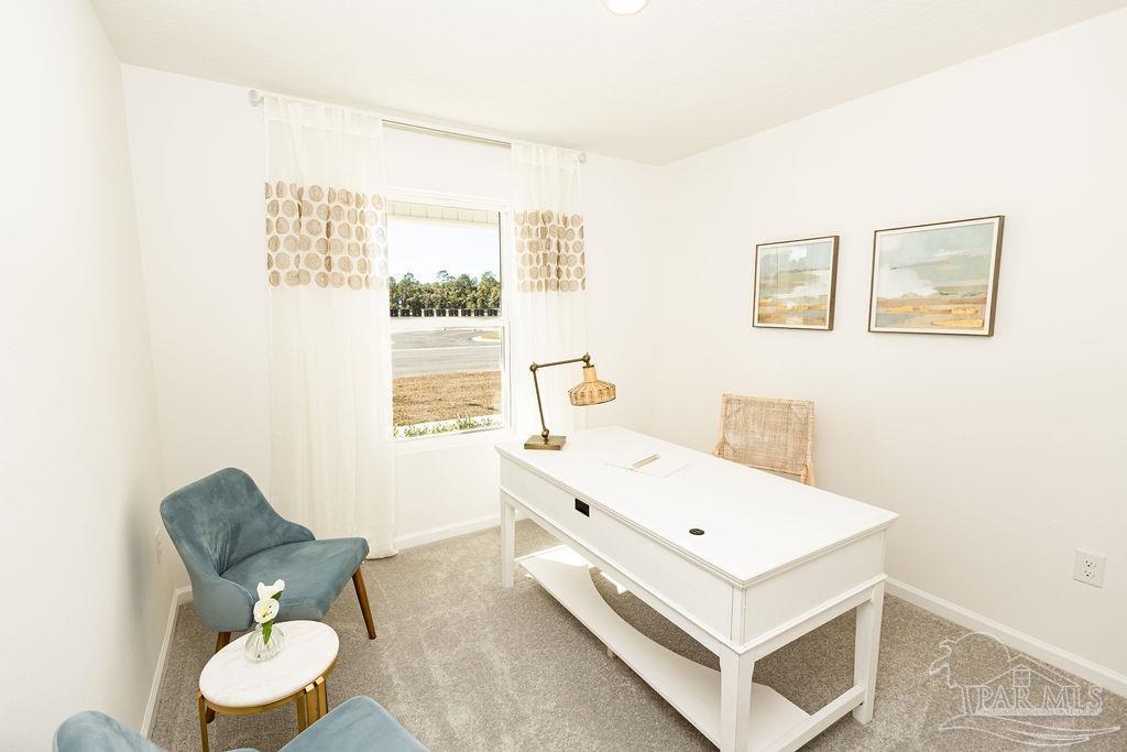 7761 Moonrise Way Milton, FL 32583 - Photo 16 of 19 a bathroom with a sink mirror and toilet