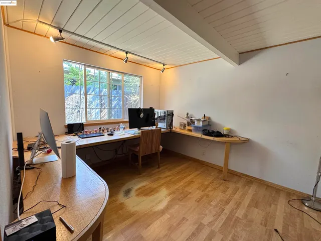 a dining room with a table and chairs