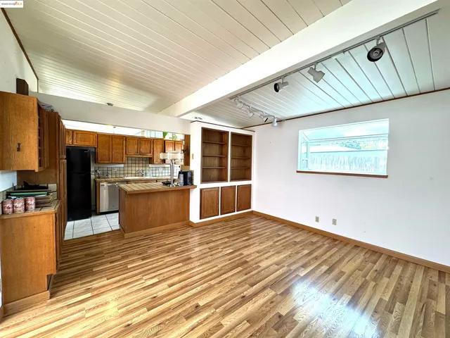 a view of kitchen with wooden floor
