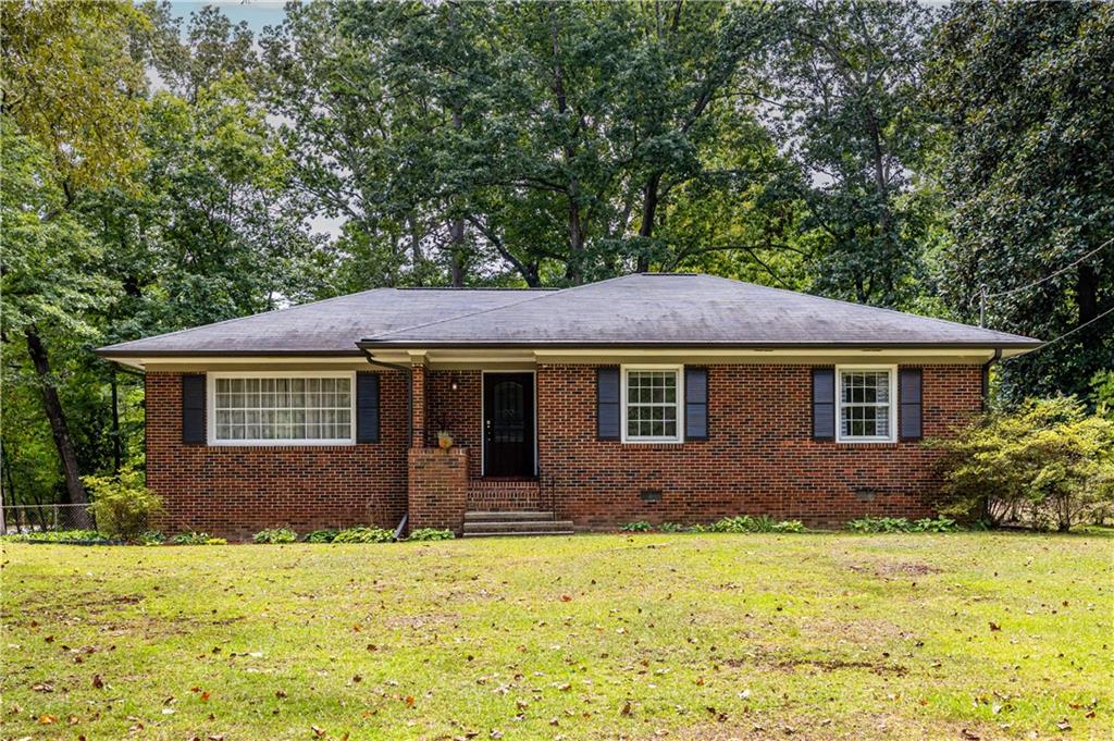 2376 Ben Hill Road Atlanta, GA 30344 - Photo 1 of 1 a front view of a house with a yard