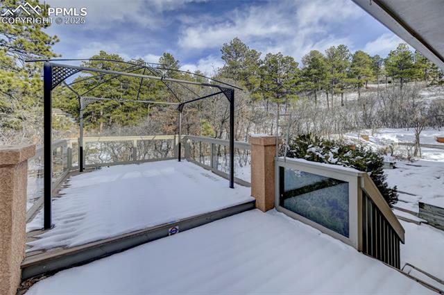 15091 Ridgefield Lane Colorado Springs, CO 80921 - Photo 7 of 35 View of snow covered patio