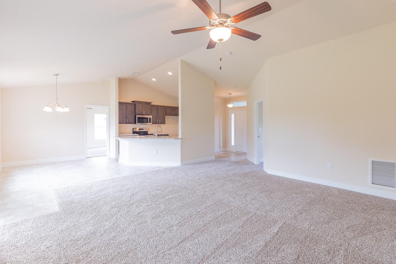 5612 Raintree Trail Fort Pierce, FL 34982 - Photo 5 of 13 1755 kithen dining family rooms