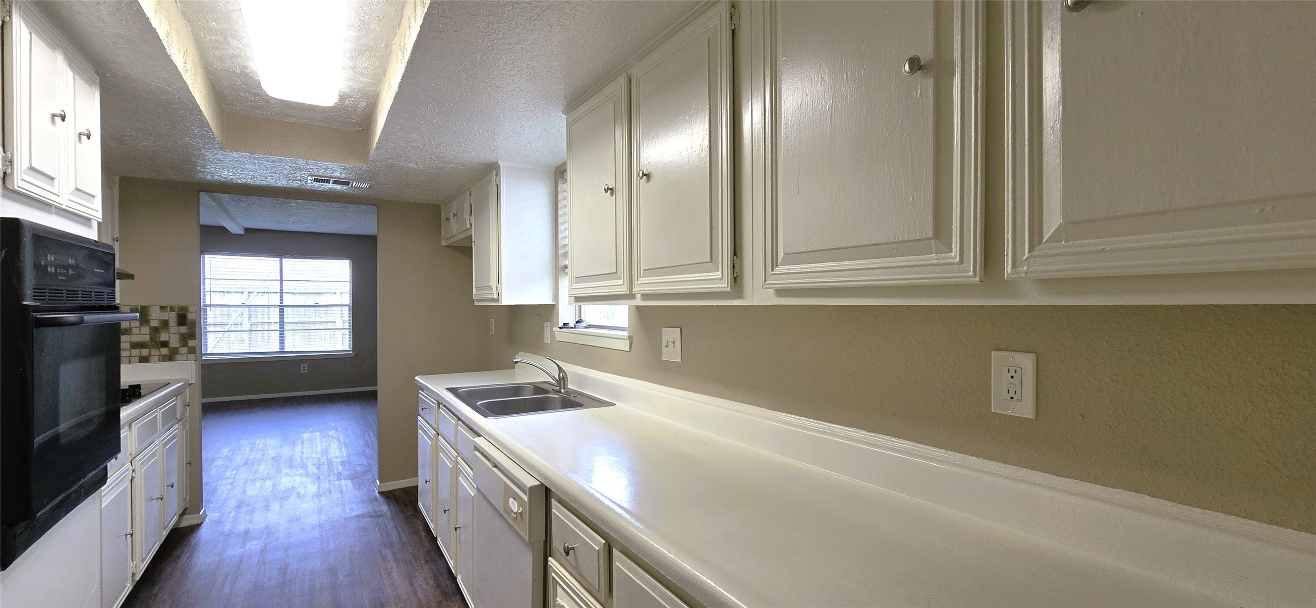 23019 Tree Bright Lane Spring, TX 77373 - Photo 8 of 20 Kitchen includes plenty of storage options with many cabinets and drawers, lots of countertop space and a double sink with a window allowing for plenty of natural light.