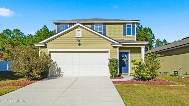 a view of a swimming pool with outdoor seating