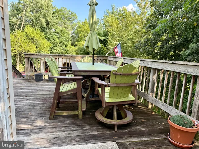 a balcony with table and chairs