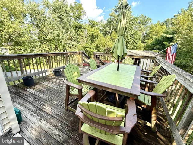 a view of a wooden deck with furniture