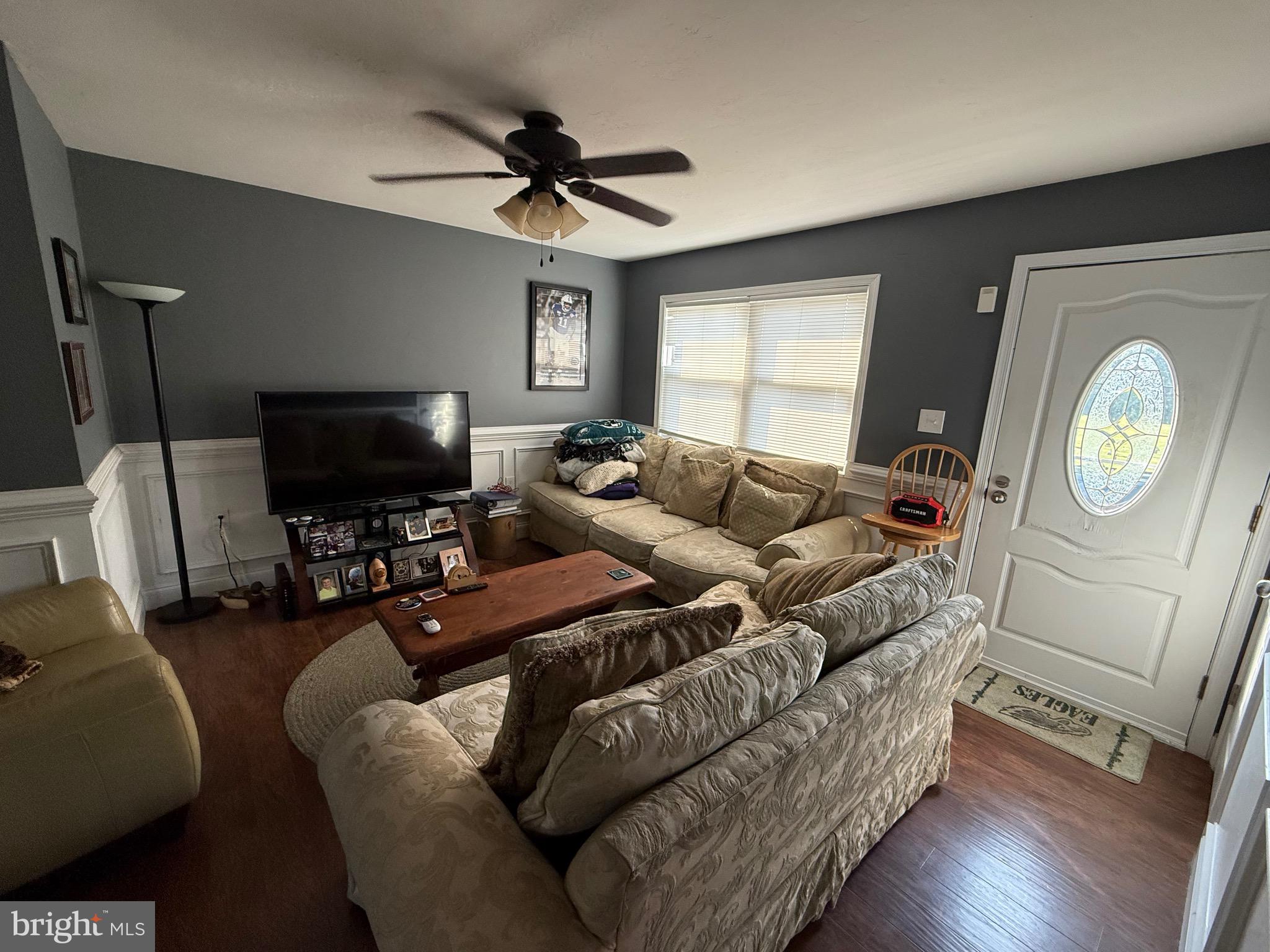 2856 West Canal Road Dover, PA 17315 - Photo 6 of 20 a living room with furniture a flat screen tv and a window