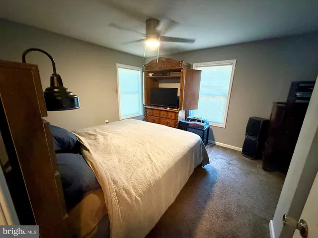 a bedroom with a bed and a television in it