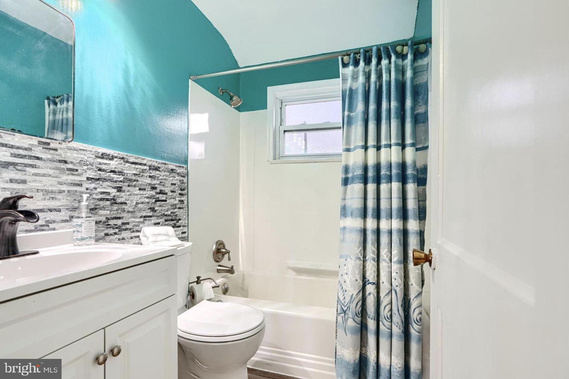 1918 Larkhall Road Baltimore, MD 21222 - Photo 21 of 25 a bathroom with a sink toilet and shower