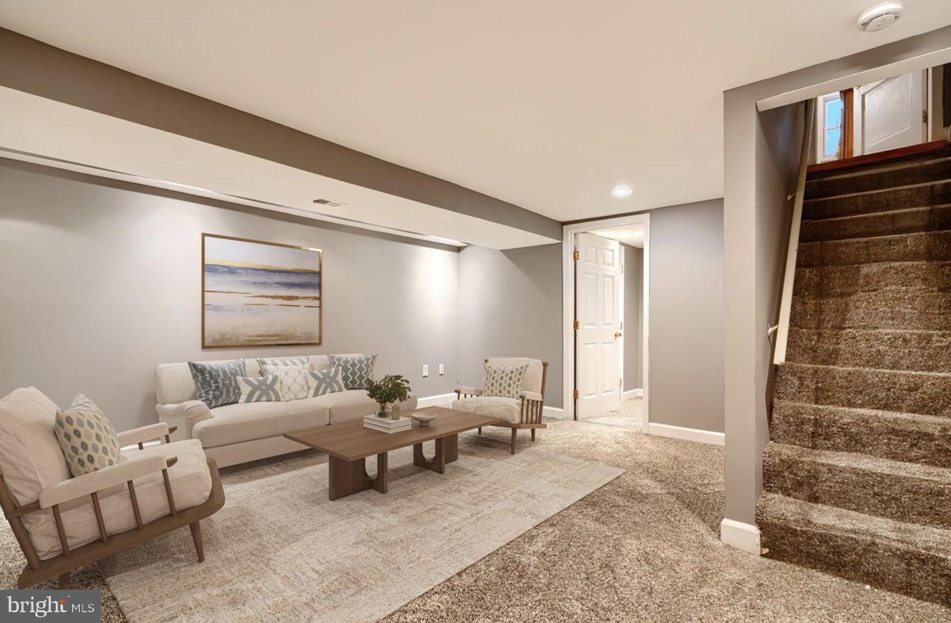 1918 Larkhall Road Baltimore, MD 21222 - Photo 22 of 25 a living room with furniture and stairs