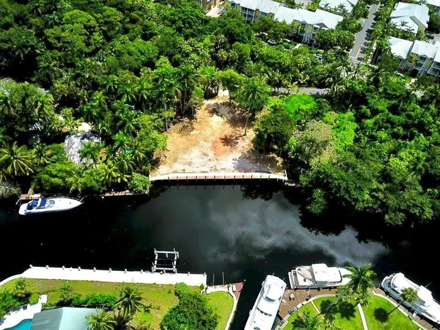 a view of house with swimming pool and outdoor seating
