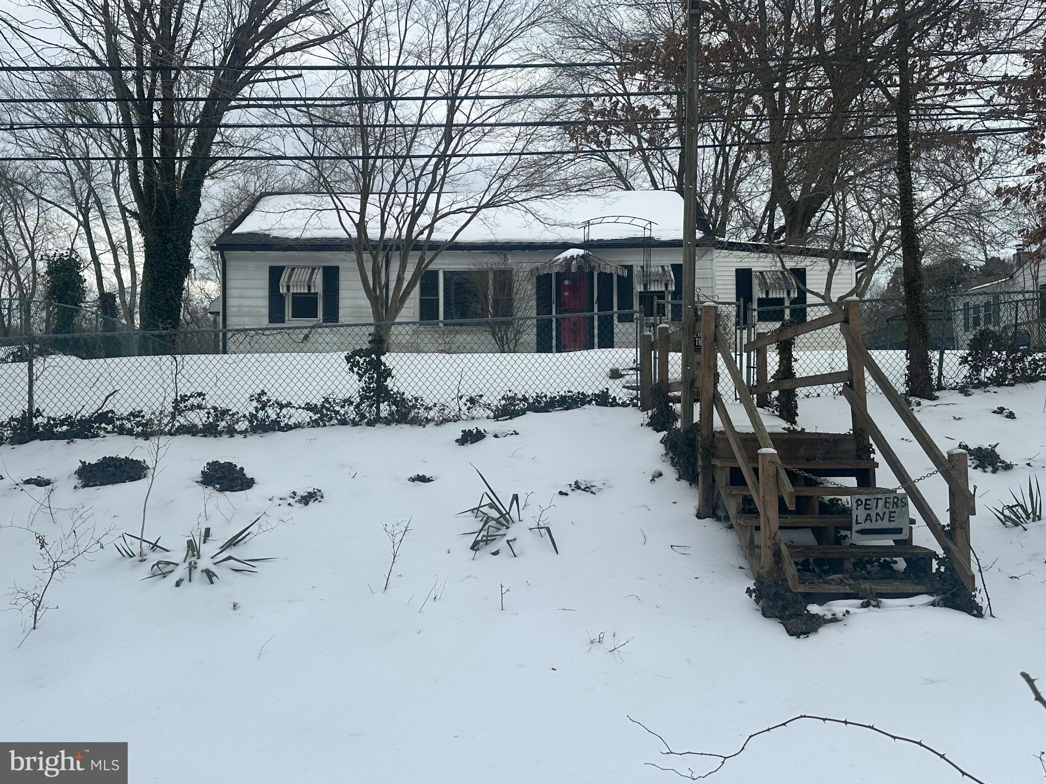 Charming home blanketed in winter's embrace.