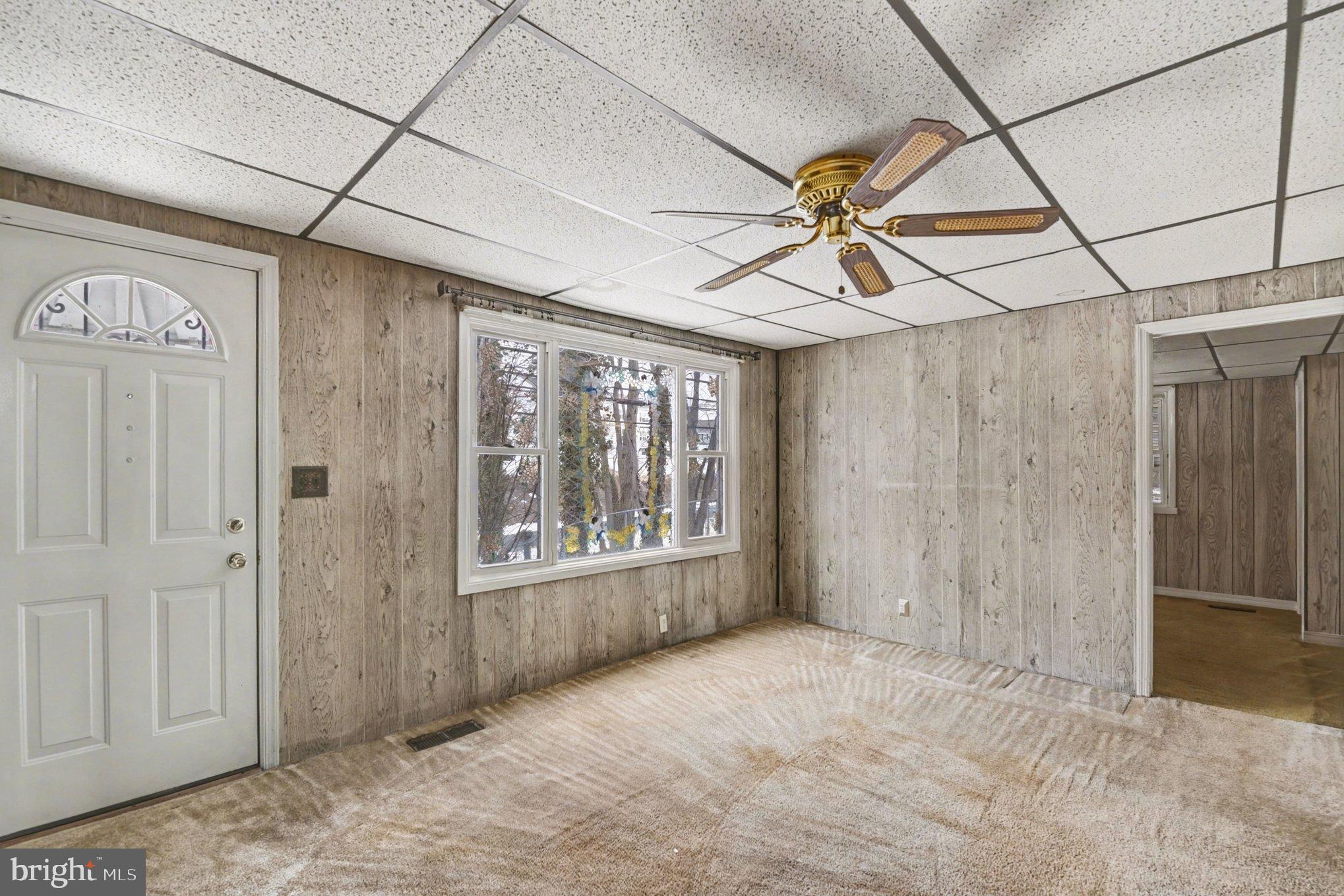 1433 Old Philadelphia Road Aberdeen, MD 21001 - Photo 4 of 32 a view of a livingroom with a window and a ceiling fan